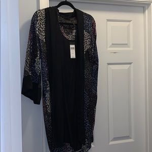 Mid length sleeved BCBG dress.